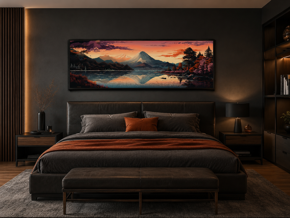Horizontal framed canvas of Mt. Fuji and Lake Kawaguchiko at sunset above a bed in a dark bedroom.