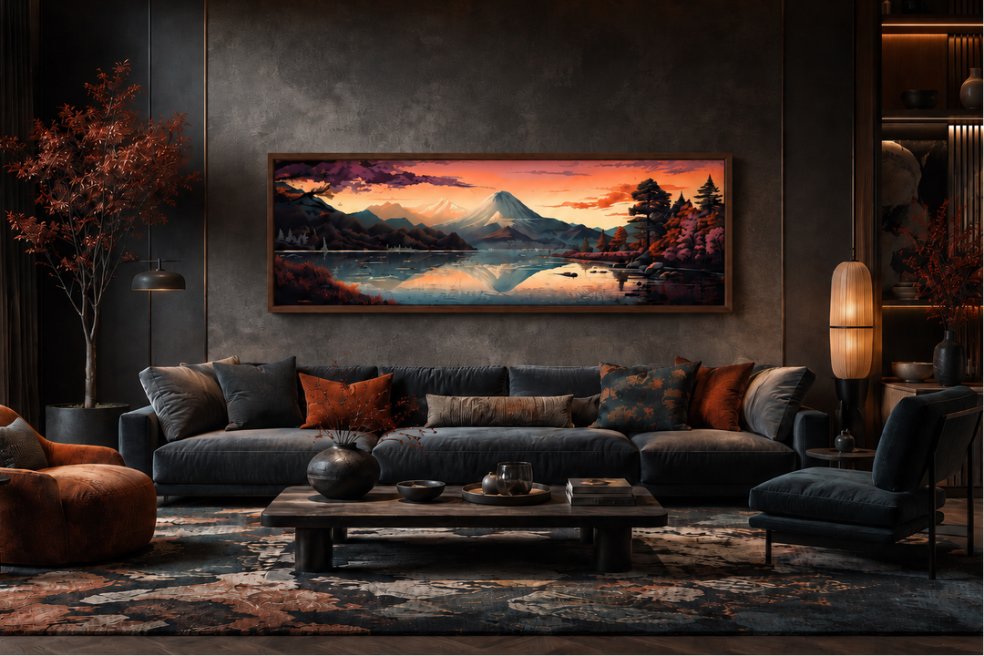Horizontal framed canvas of Mt. Fuji and Lake Kawaguchiko at sunset above a dark velvet sofa.