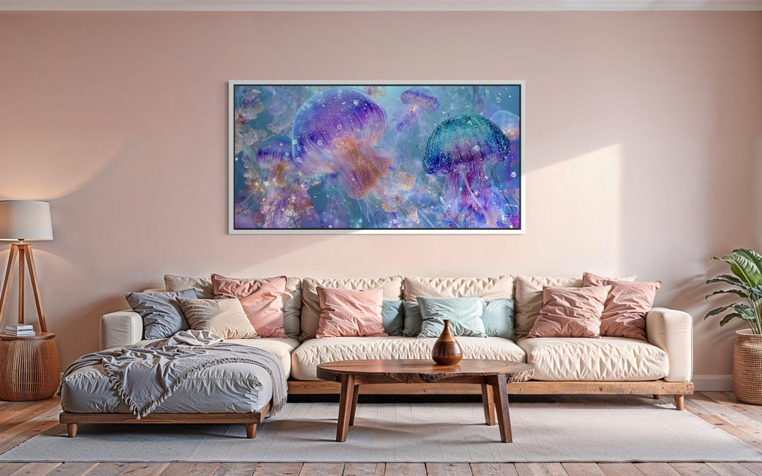 Colorful jellyfish canvas wall art in purple and blue tones hanging above a modern sofa.