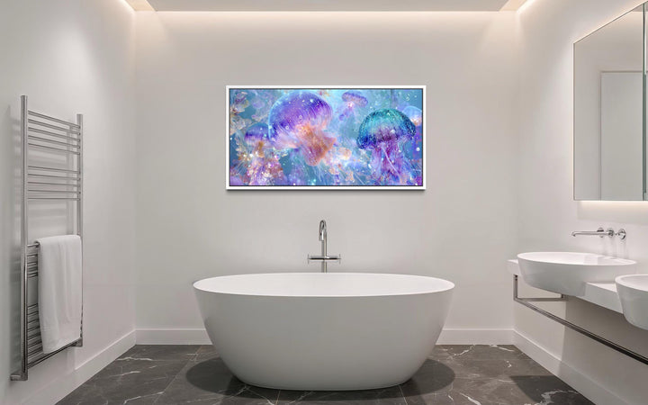 Colorful jellyfish canvas wall art in a modern bathroom above a white freestanding tub.