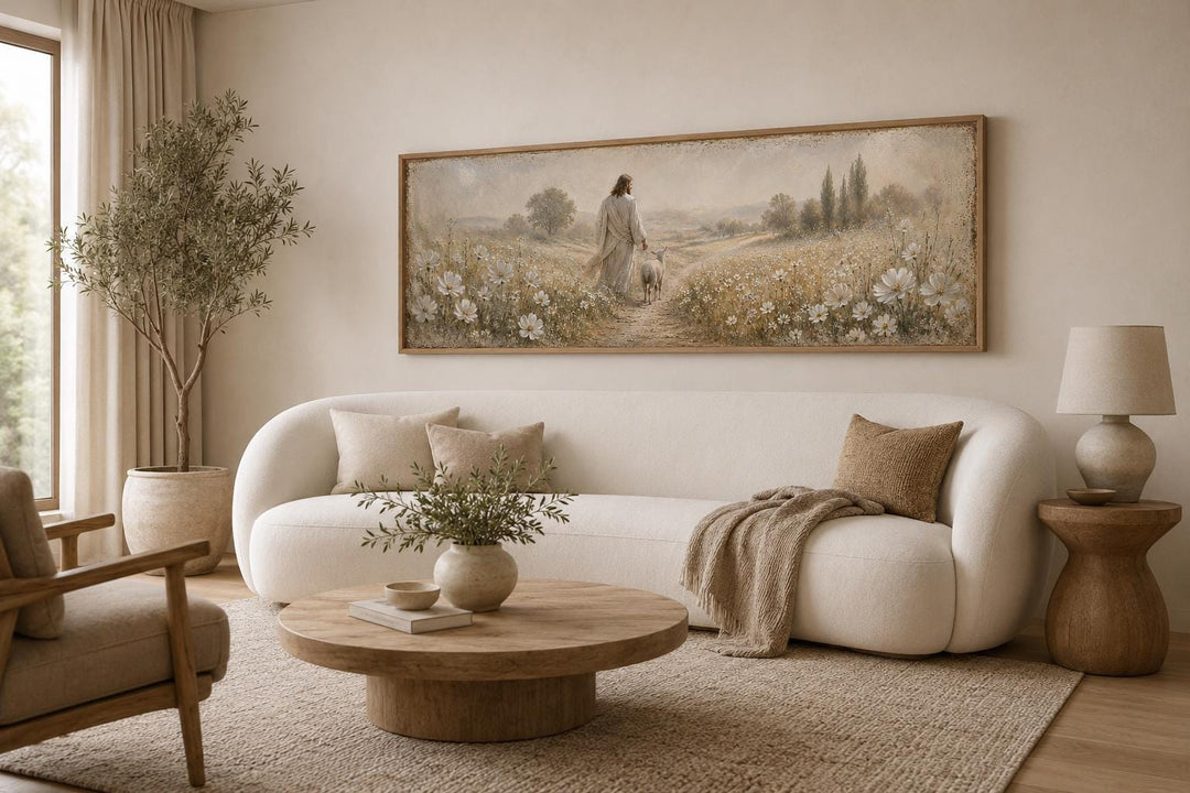 Jesus and lamb in a wildflower field canvas print in a neutral farmhouse living room.