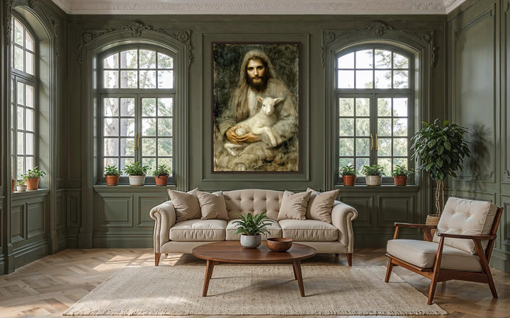 Framed canvas wall art of Jesus holding a lamb centered in a classic, green-walled living room.