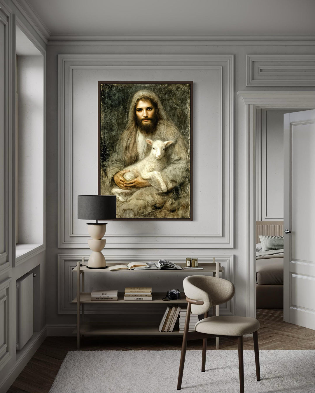 Framed canvas wall art of Jesus holding a lamb, displayed in a modern, neutral-toned room.