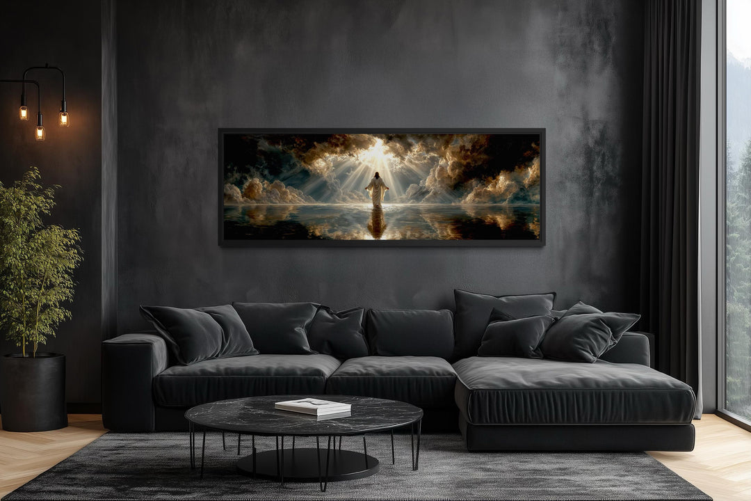 Panoramic canvas print of Jesus walking on water displayed in a modern dark living room.