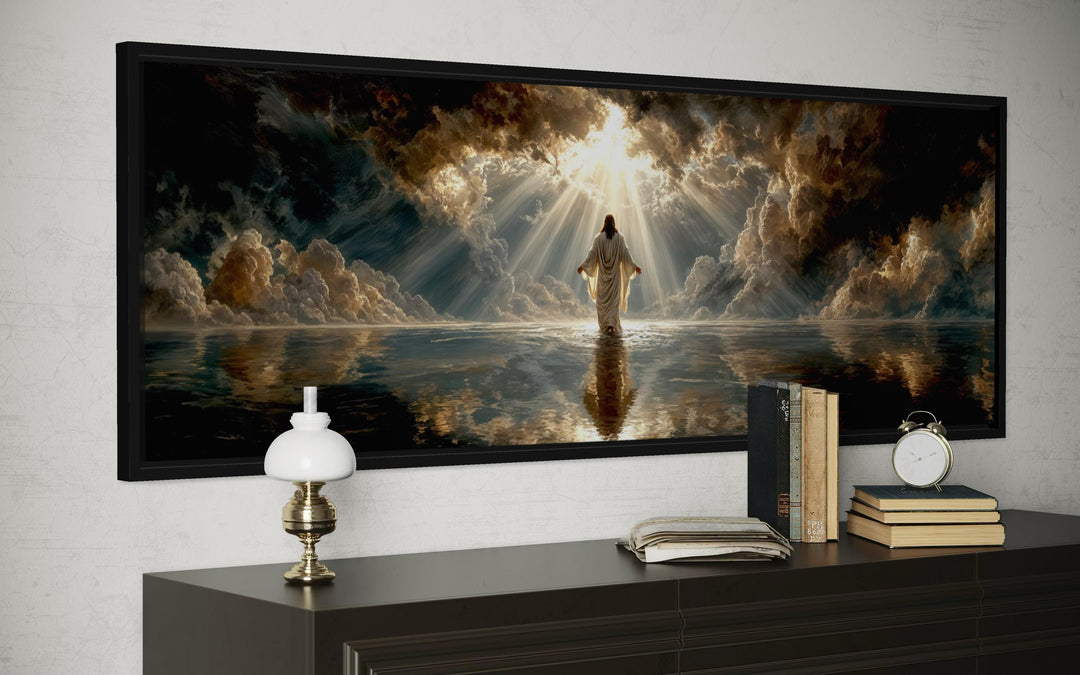 Panoramic canvas print of Jesus walking on water under a dramatic sky, displayed above a sideboard.