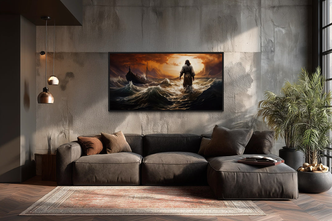 Jesus walking on water in storm framed canvas wall art above a modern brown sofa in a living room.