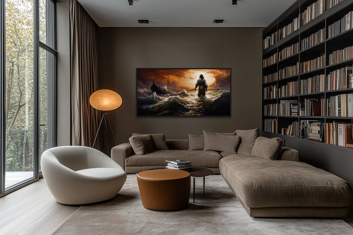Framed canvas wall art of Jesus walking on water in a storm above a sofa in a modern living room.