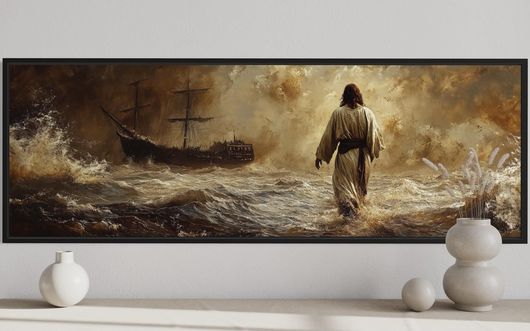 Framed horizontal canvas art of Jesus walking on stormy water toward a ship in a golden-brown light.