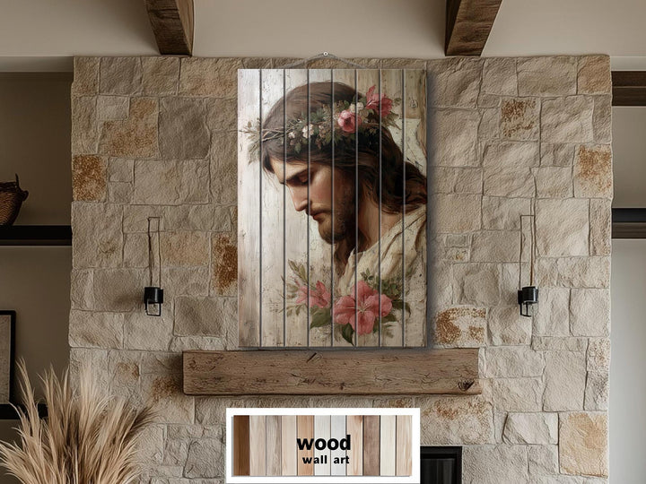 Vertical wood wall art featuring a portrait of Jesus with a floral crown on a stone wall.