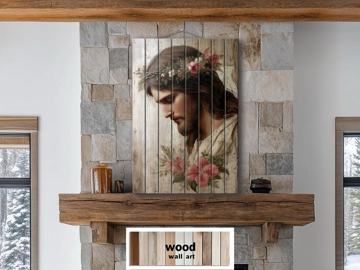 Jesus with flowers distressed wood wall art for Christian decor hanging on a stone fireplace.