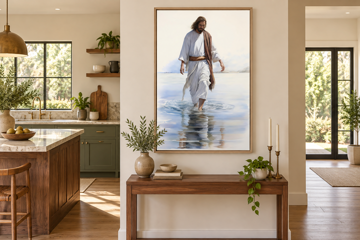 Framed watercolor painting of Jesus walking on water displayed on a wall above a wooden console table.