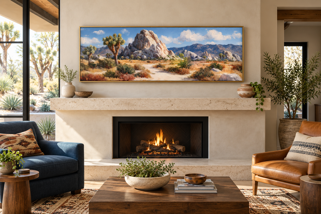 Joshua Tree Forest long horizontal canvas wall art in a gold frame above a modern stone fireplace.