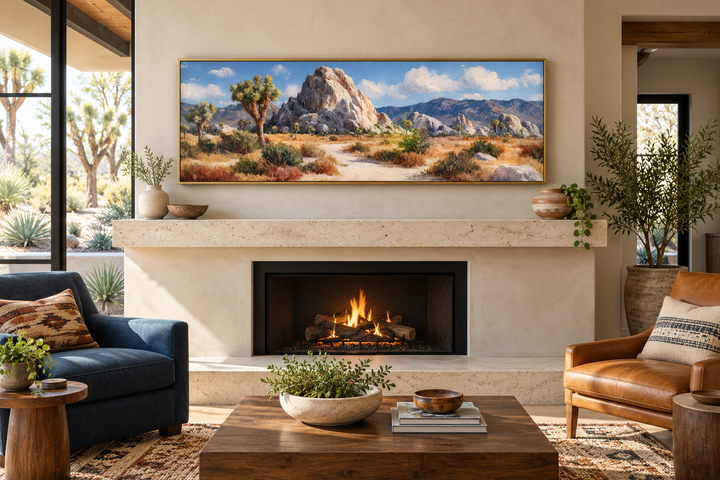 Joshua Tree Forest long horizontal canvas wall art in a gold frame above a modern stone fireplace.