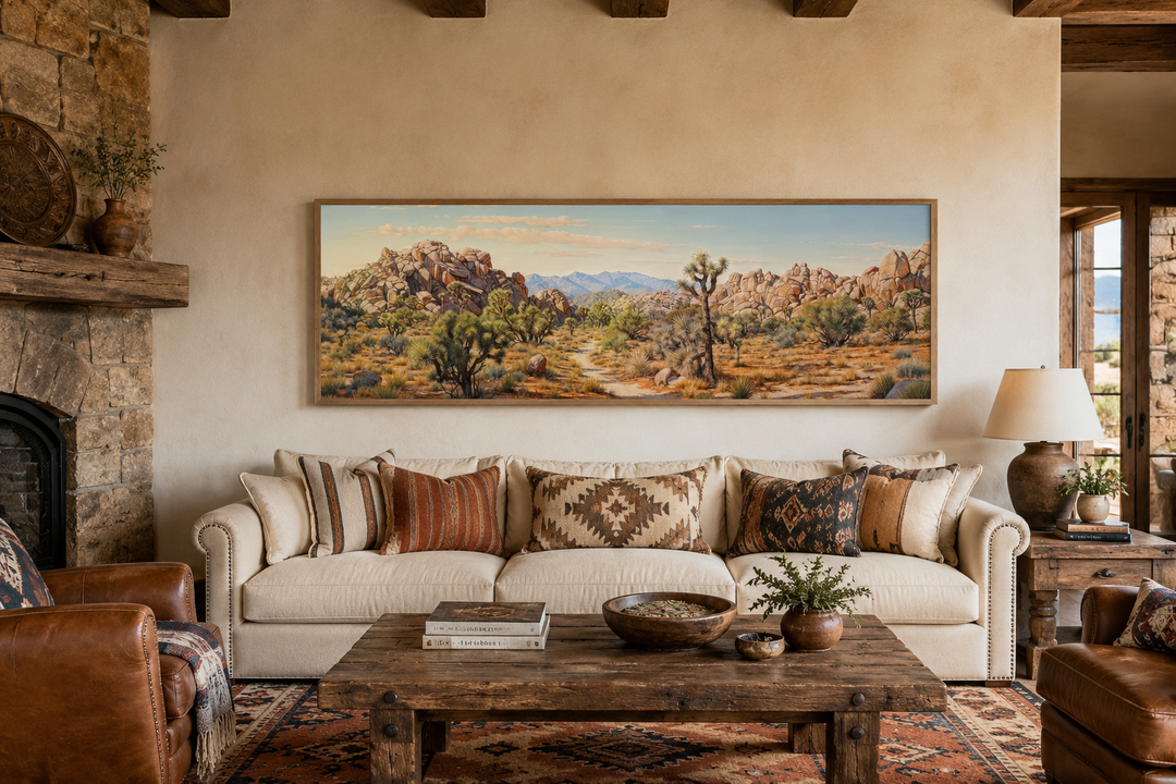 Joshua Tree National Park horizontal canvas wall art in a desert landscape painting above a sofa.