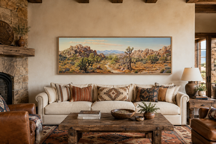Joshua Tree National Park horizontal canvas wall art in a desert landscape painting above a sofa.