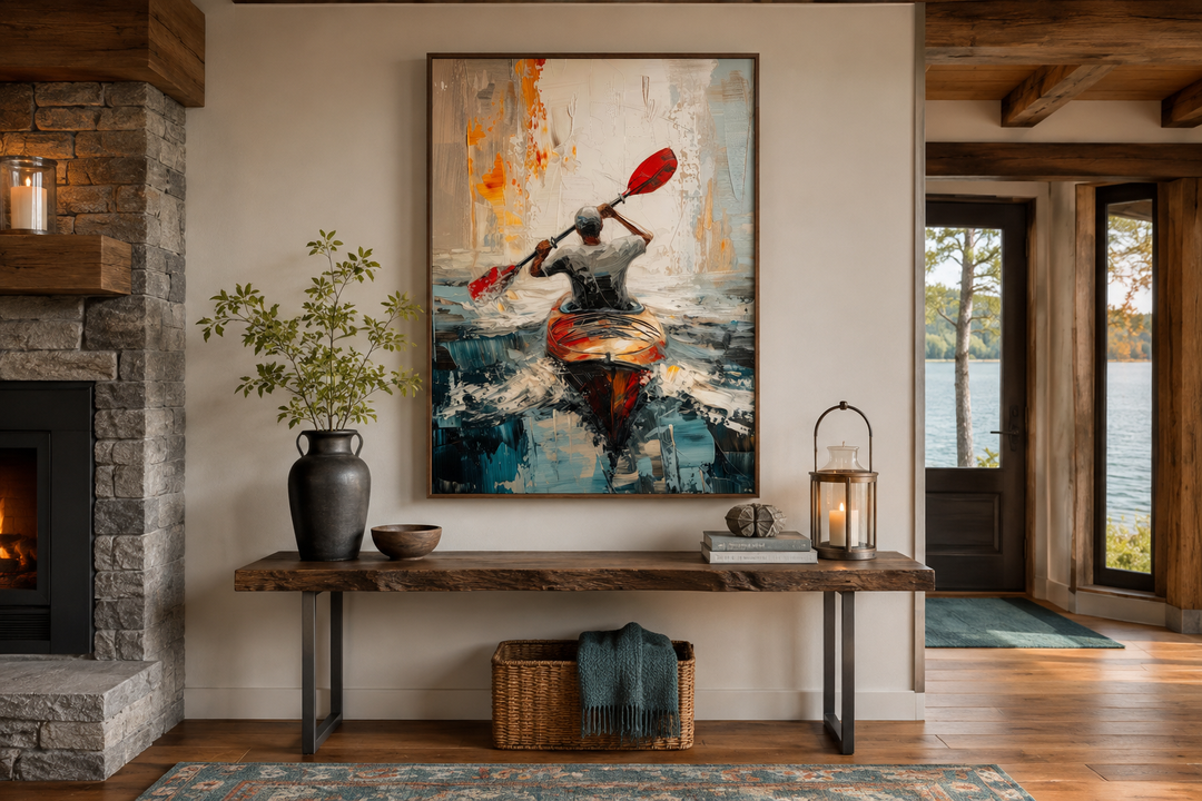 Abstract framed canvas wall art of a kayaker on a lake, displayed above a wooden console table.