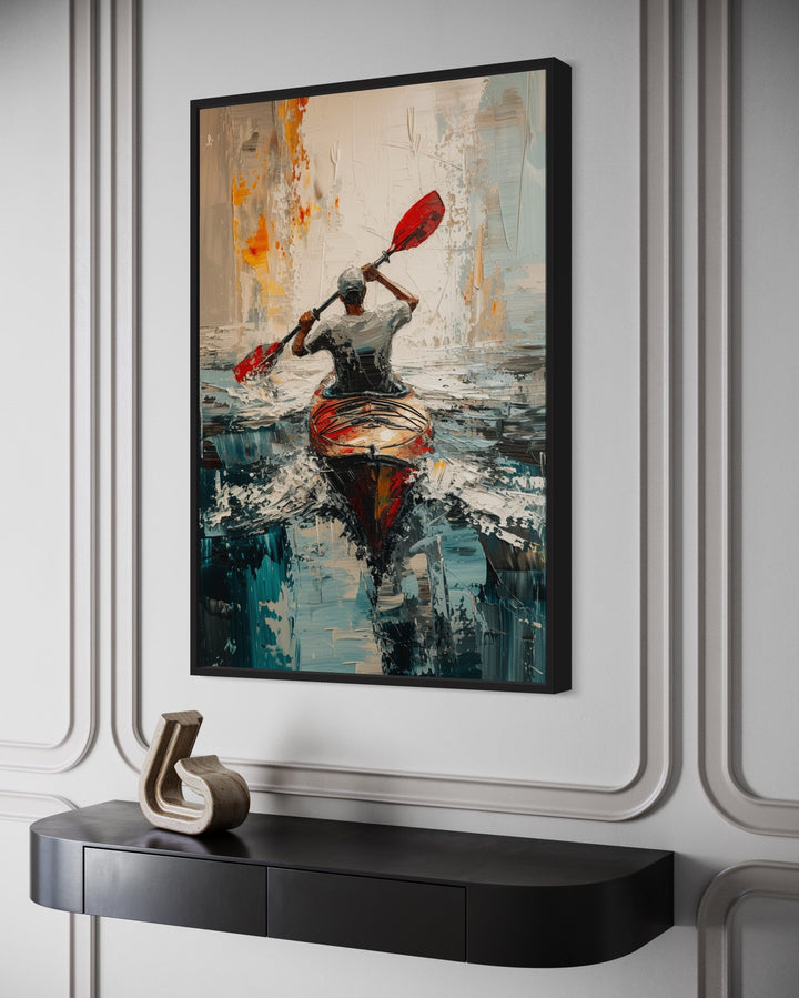 Abstract framed canvas wall art of a kayaker on a lake with vibrant red, orange, and teal tones.