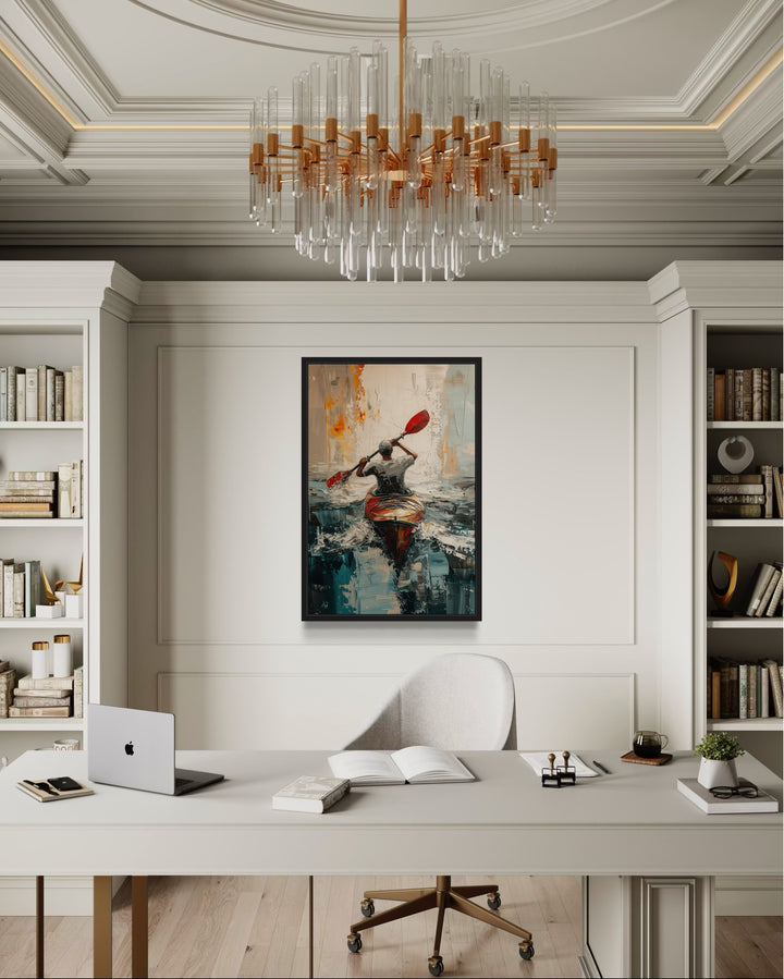 Framed abstract canvas wall art of a kayaker on a lake, hung in a modern home office.