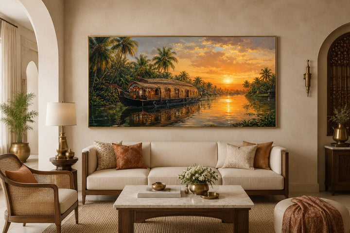 Kerala Backwaters houseboat painting at sunset on a canvas above a sofa in a warm living room.
