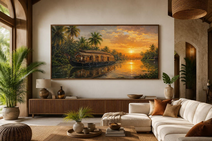 Kerala Backwaters houseboat painting at sunset on a living room wall above a wooden console.