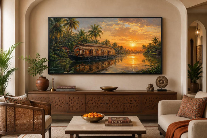Kerala backwaters houseboat painting at sunset, framed canvas wall art in an Indian living room.