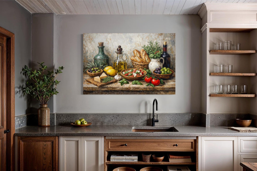 Mediterranean food still life canvas art displayed on a gray wall above a modern kitchen sink.