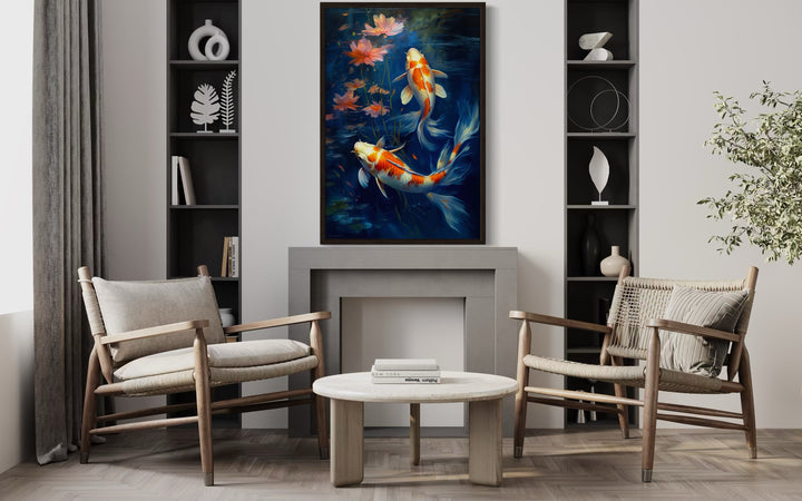 Koi Fish In Navy Blue Water Feng Shui Framed Canvas Wall Art hanging above a modern fireplace.