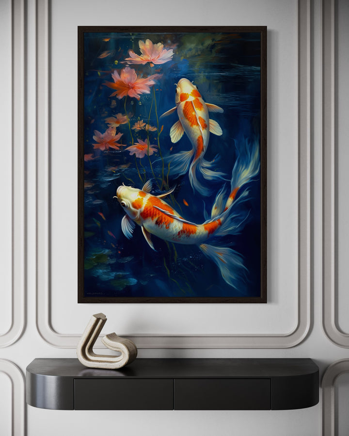 Framed canvas wall art of two orange and white koi fish swimming in deep navy blue water.