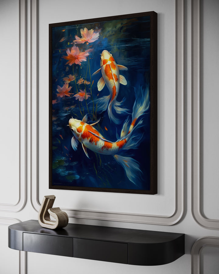 Framed canvas wall art of two orange and white koi fish swimming in deep navy blue water.