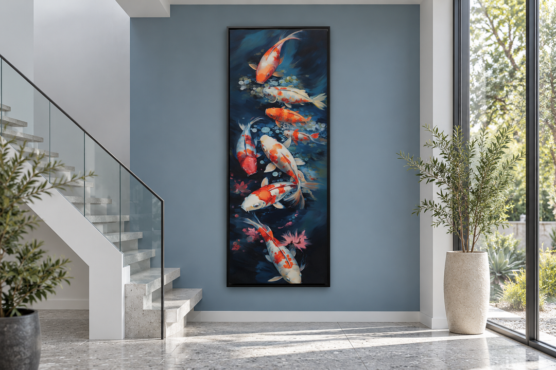 Tall narrow vertical canvas art of koi fish swimming in navy blue water, in a black frame.