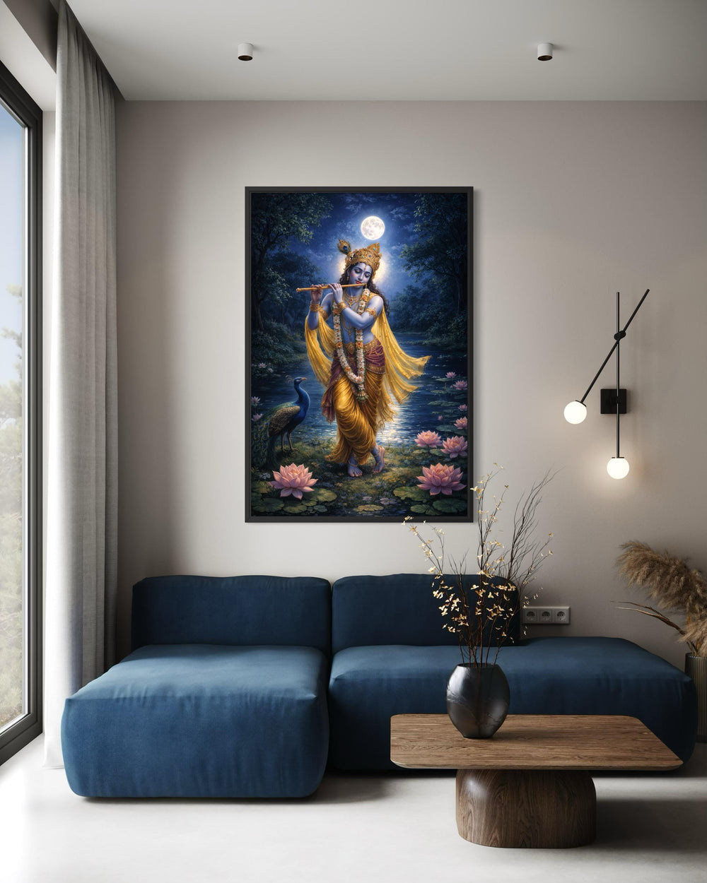 A framed canvas print of Lord Krishna playing a flute by a lotus pond hangs in a modern living room.