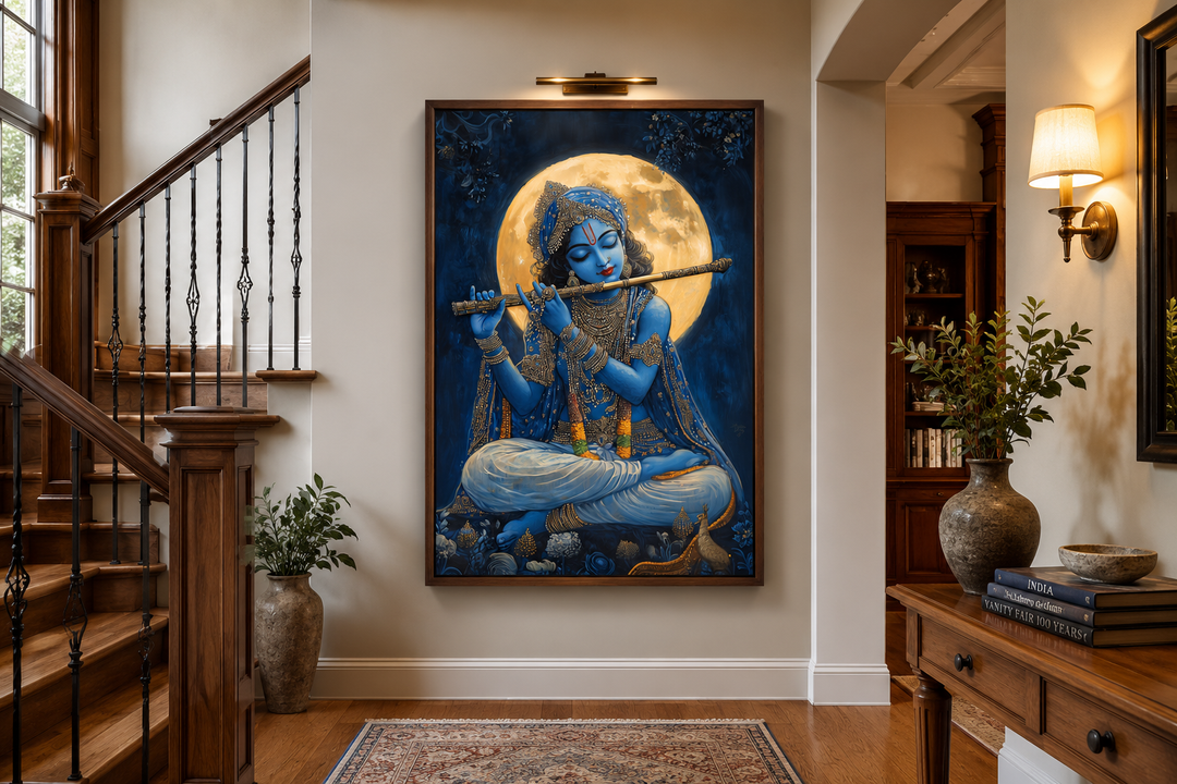 Framed canvas art of Blue Krishna playing a flute under a full moon in a traditional home hallway.