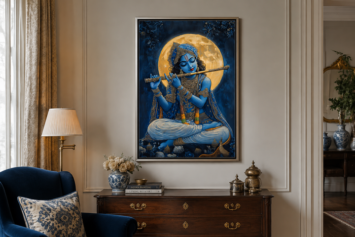Framed canvas wall art of Blue Krishna playing a flute under a full moon in a living room setting.