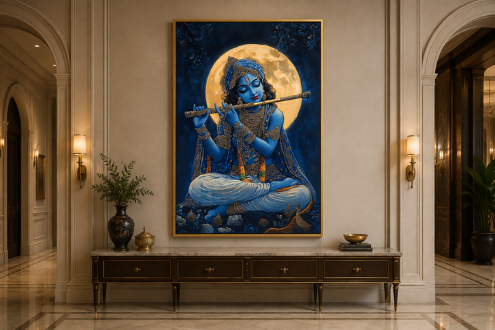 Blue Krishna playing flute under a full moon framed canvas wall art above a console table.