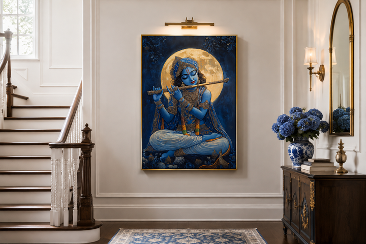 Blue Krishna playing a flute under a full moon, framed canvas wall art in a traditional home setting.
