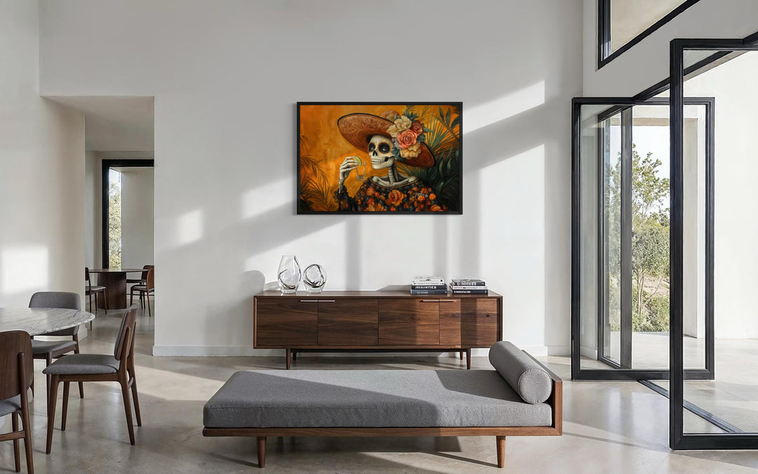 La Calavera Catrina Drinking Tequila Mexican canvas wall art displayed in a modern living room.