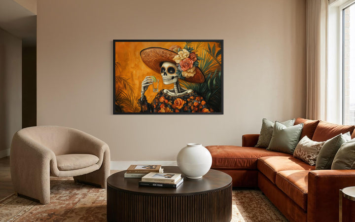 La Calavera Catrina Drinking Tequila Mexican canvas wall art in a modern living room.