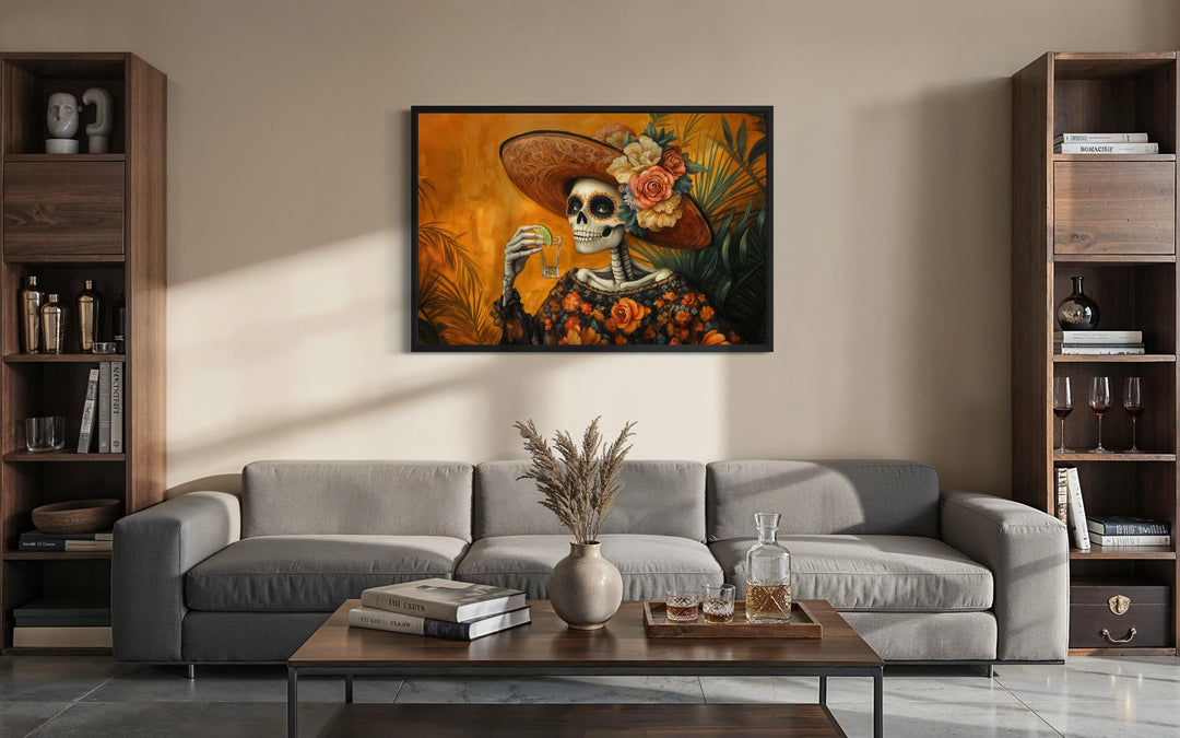 La Calavera Catrina Mexican canvas wall art featuring a skeleton drinking tequila in a modern room.