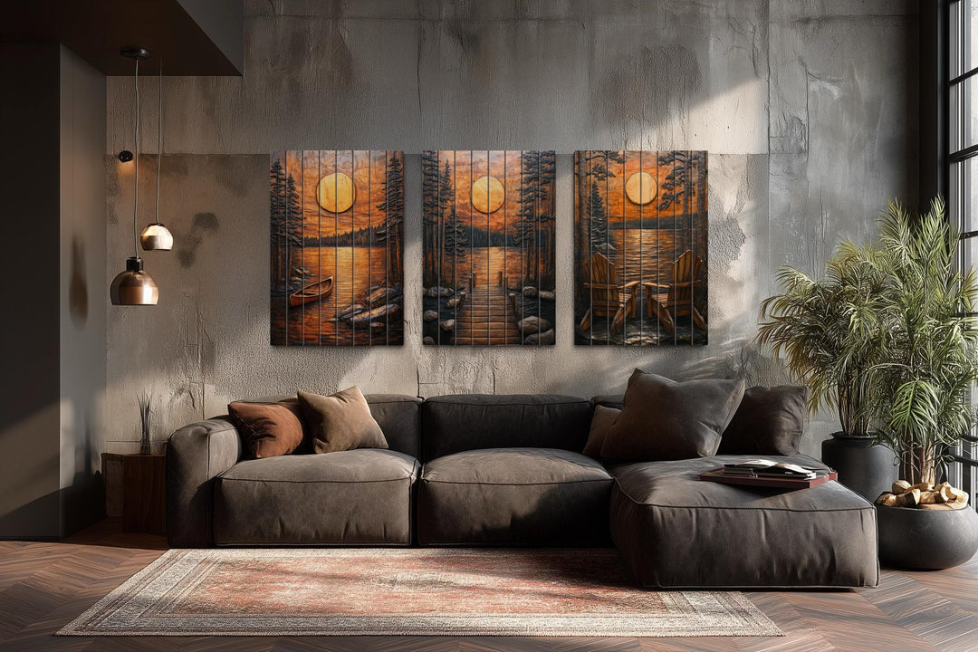 Set of three rustic wood wall art panels featuring a canoe, dock, and chairs at a lakeside sunset.