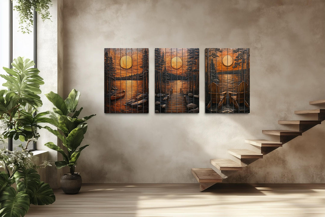 Three-piece rustic wood wall art set featuring a sunset lake scene with a canoe, dock, and chairs.