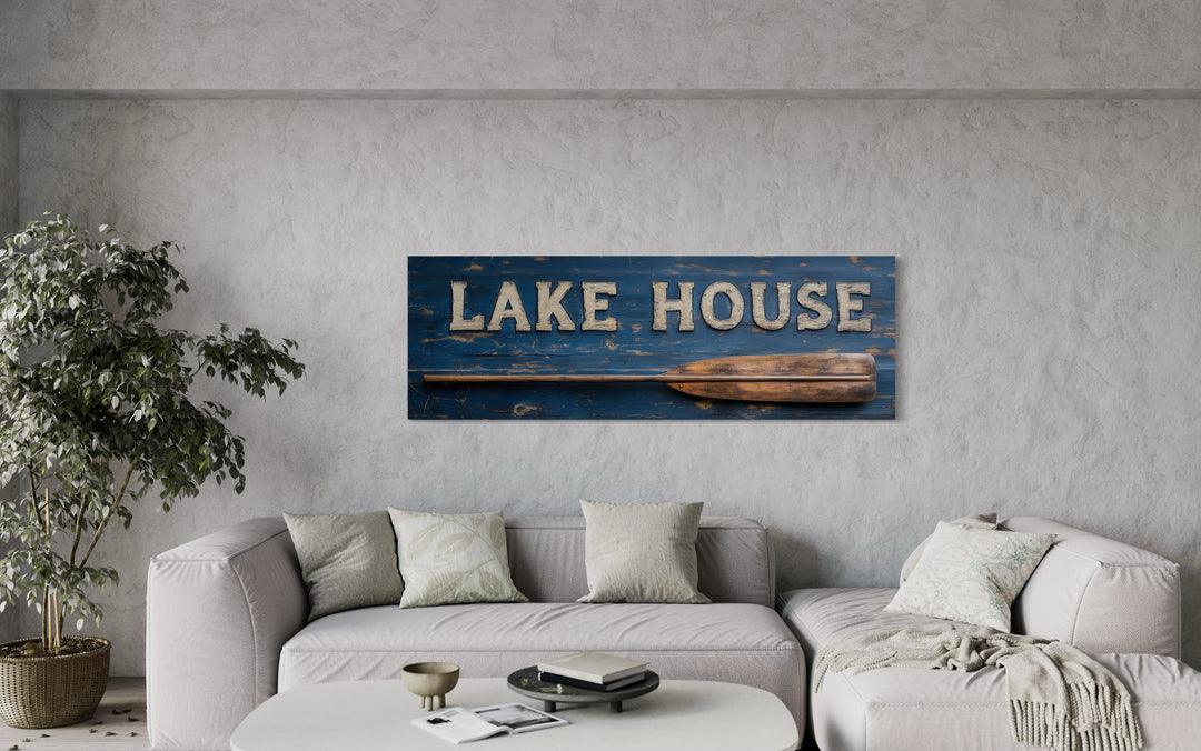 Lake House Sign With Oar Long Horizontal Framed Canvas Wall Art above a modern sofa.