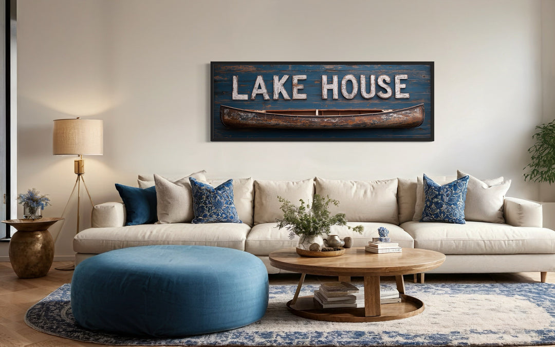 Horizontal framed canvas wall art featuring a blue Lake House sign and a rustic wooden canoe.