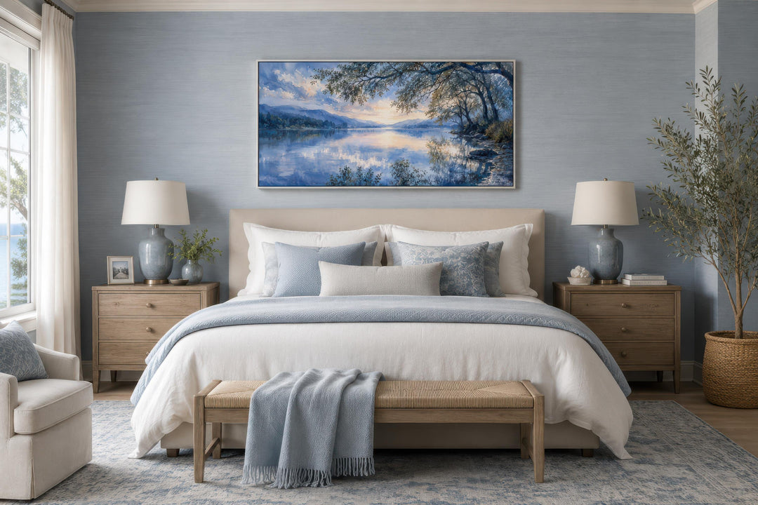 Blue Lake House wall art framed canvas print of a calm lake at sunset above a bed in a bedroom.