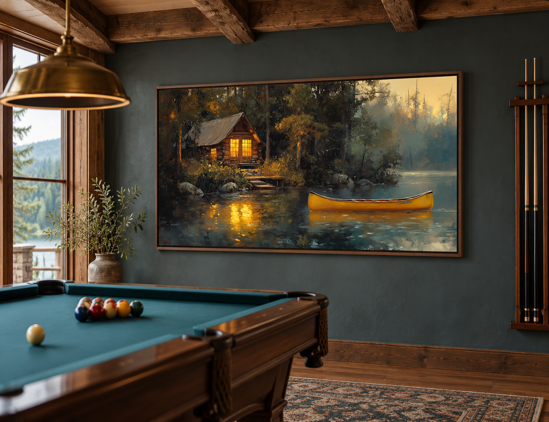 Framed rustic lake house canvas print with a yellow canoe on a lake, hung in a billiard room.