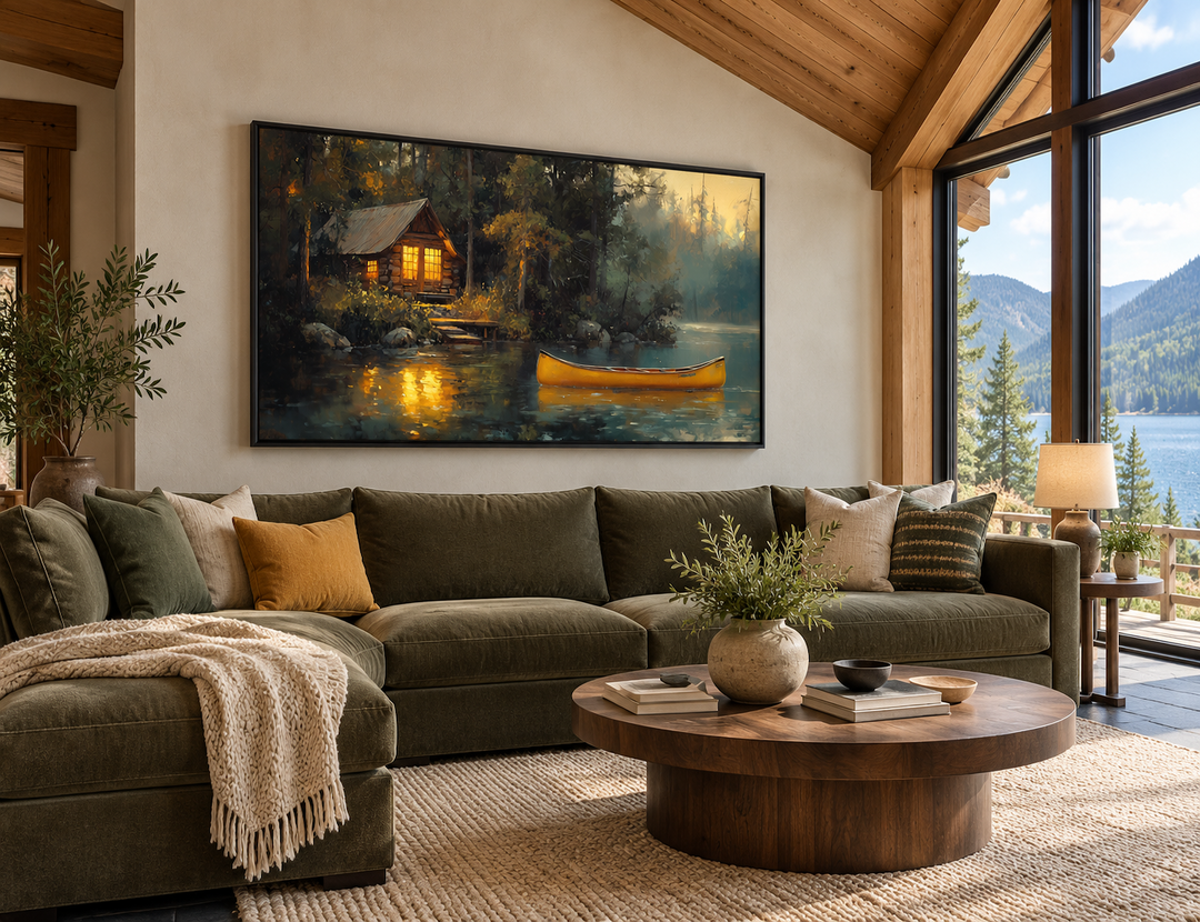 Framed rustic lake house canvas print with a yellow canoe on a lake, hung in a cozy living room.
