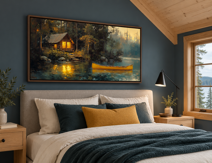 Framed canvas wall art of a rustic lake house in the woods with a yellow canoe on the water.
