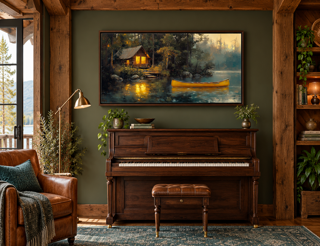 Framed canvas wall art of a rustic lake house in the woods with a yellow canoe on the water.