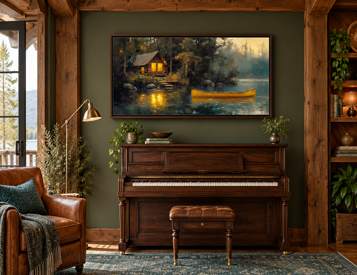 Framed canvas wall art of a rustic lake house in the woods with a yellow canoe on the water.
