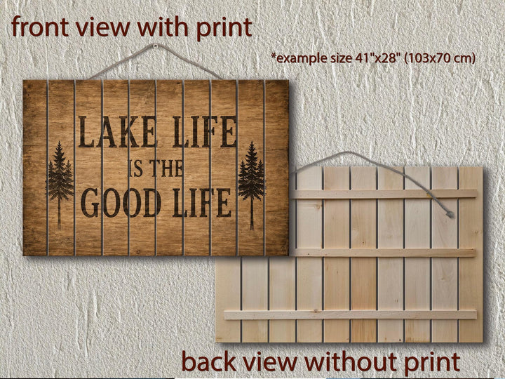Front and back view of a rustic wood sign reading Lake Life Is The Good Life with pine tree icons.