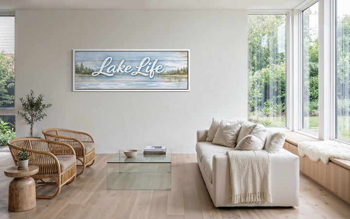 A large panoramic canvas wall art featuring Lake Life script over a rustic lakeside landscape.